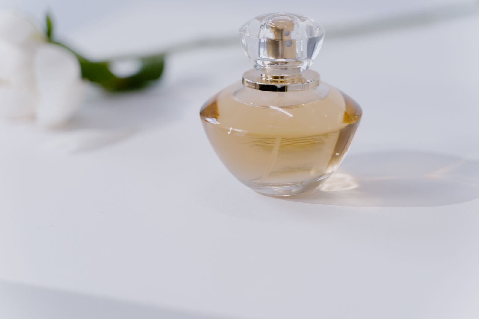 A perfume bottle arranged as a small product on a tabletop.