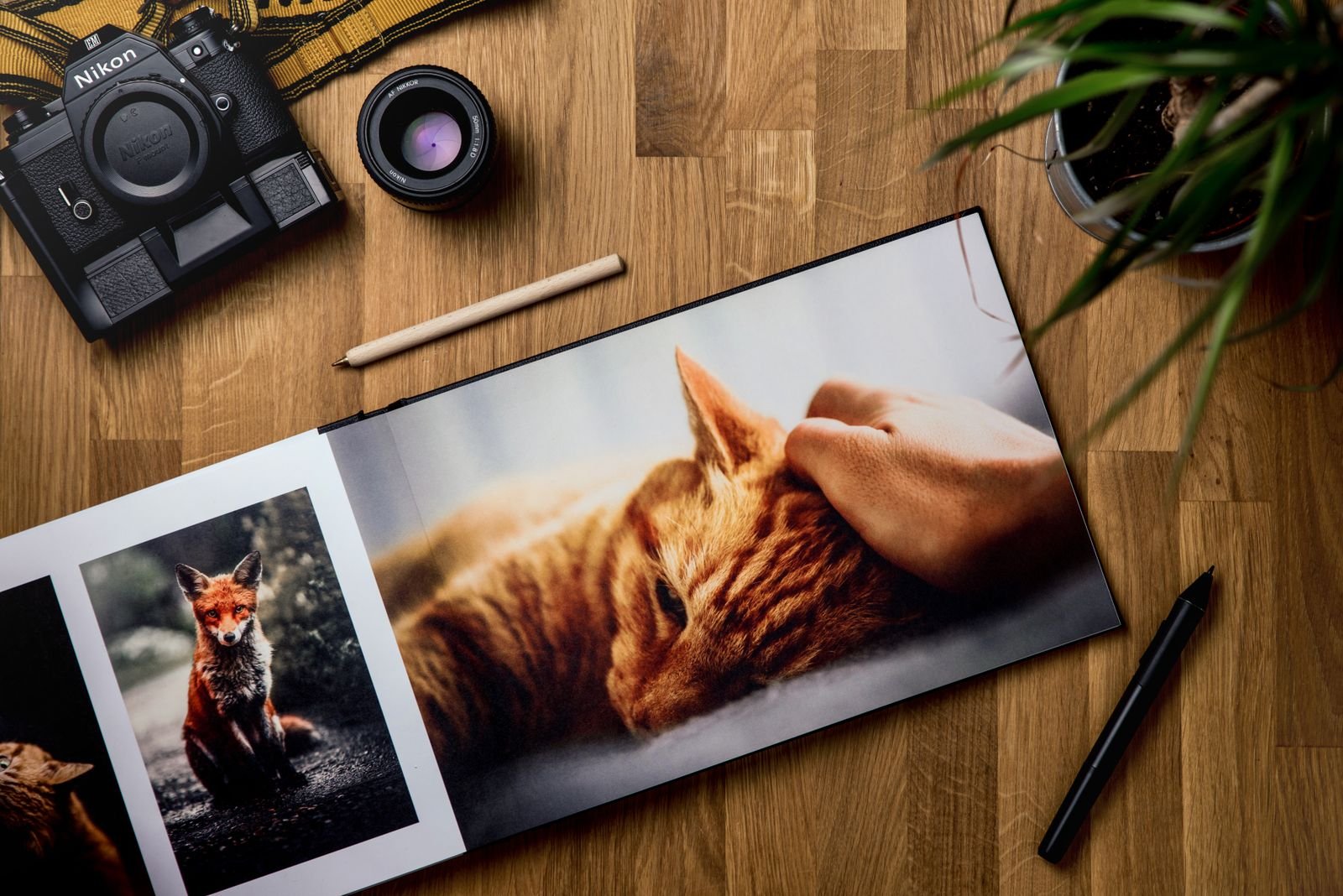 An open photo book on a wooden table.