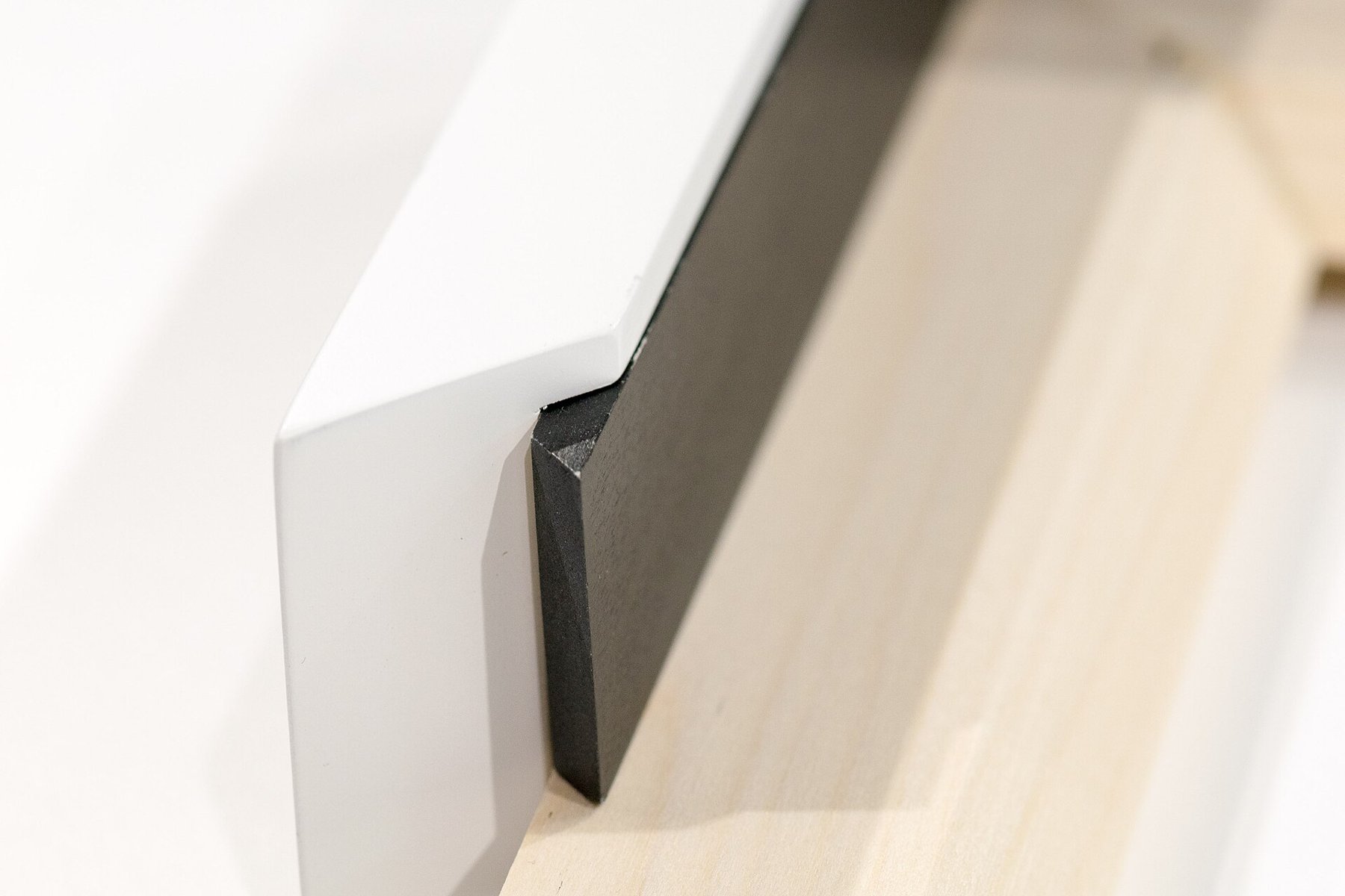 Cross-section of a picture frame showing separate layers.